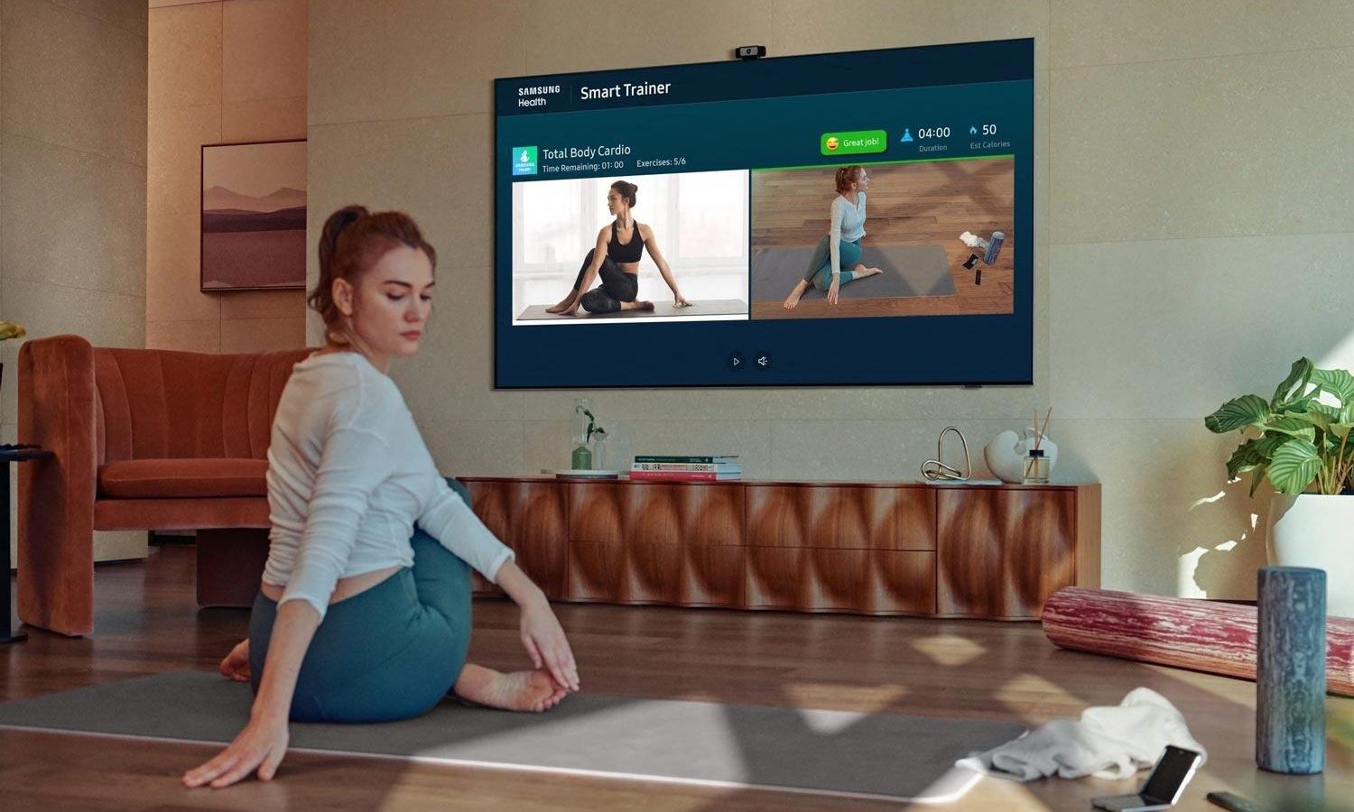 Samsung Smart TV on a modern stand displaying vibrant visuals, highlighting sleek design, high-resolution screen, and integrated smart features.